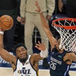 
              Utah Jazz guard Donovan Mitchell (45) goes to the basket as Dallas Mavericks guard Spencer Dinwiddie (26) defends in the second half of Game 4 of an NBA basketball first-round playoff series, Saturday, April 23, 2022, in Salt Lake City. (AP Photo/Rick Bowmer)
            