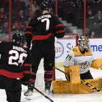 
              Nashville Predators goaltender Juuse Saros (74) makes a save in front of Ottawa Senators left wing Brady Tkachuk (7) and right wing Connor Brown (28) during the second period of an NHL hockey game Thursday, April 7, 2022 in Ottawa, Ontario. (Justin Tang/The Canadian Press via AP)
            