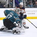 
              San Jose Sharks goaltender James Reimer (47) stretches out to block a shot by Edmonton Oilers center Connor McDavid (97) during the second period of an NHL hockey game Tuesday, April 5, 2022, in San Jose, Calif. (AP Photo/Tony Avelar)
            