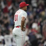 
              Philadelphia Phillies relief pitcher Jeurys Familia reacts after giving up a three-run home run to Colorado Rockies' C.J. Cron during the seventh inning of a baseball game Tuesday, April 19, 2022, in Denver. (AP Photo/David Zalubowski)
            