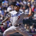
              Los Angeles Dodgers starting pitcher Julio Urias works against the Colorado Rockies in the first inning of a baseball game Sunday, April 10, 2022, in Denver. (AP Photo/David Zalubowski)
            