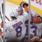 
              New York Islanders players celebrate a goal by teammate Zach Parise against the Montreal Canadiens during third-period NHL hockey game action in Montreal, Friday, April 15, 2022. (Graham Hughes/The Canadian Press via AP)
            