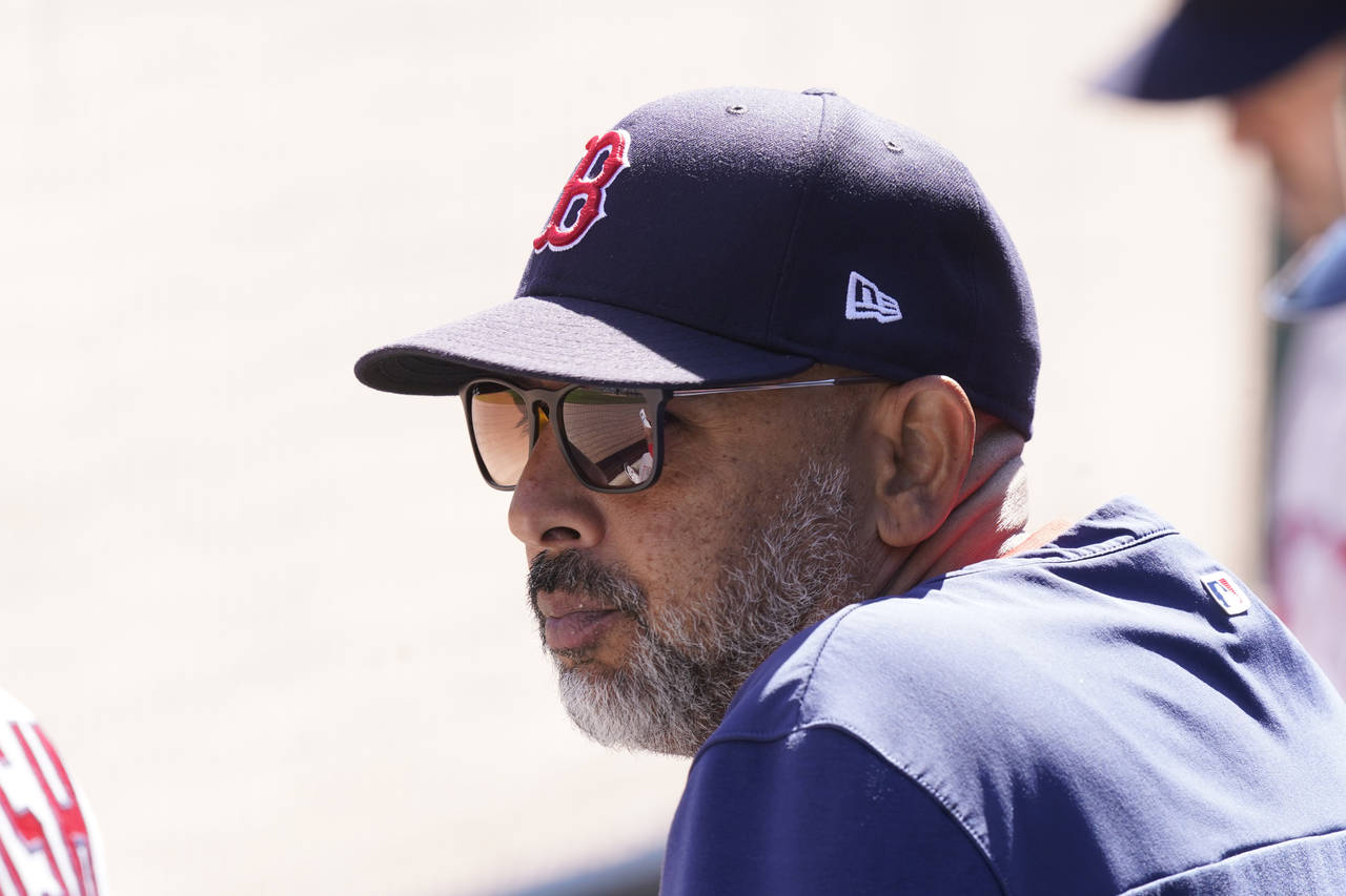 Boston Red Sox manager Alex Cora watches form the dugout during the fifth inning of a baseball game...