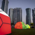 
              Domes featuring different national colors are displayed near the Doha Exhibition and Convention Center where soccer World Cup draw will be held, in Doha, Qatar, Thursday, March 31, 2022. The final draw will be held on April 1. (AP Photo/Darko Bandic)
            