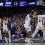 
              Kansas players celebrate after a college basketball game against North Carolina in the finals of the Men's Final Four NCAA tournament, Monday, April 4, 2022, in New Orleans. (AP Photo/David J. Phillip)
            