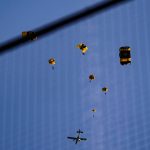 
              The U.S. Army Parachute Team the Golden Knights jump out of their aircraft before a baseball game between the Washington Nationals and the Arizona Diamondbacks at Nationals Park, Wednesday, April 20, 2022, in Washington. The U.S. Capitol was briefly evacuated after police said they were tracking an aircraft “that poses a probable threat,” but the plane turned out to be the military aircraft with people parachuting out of it for a demonstration at the Nationals game, officials told The Associated Press. (AP Photo/Alex Brandon)
            