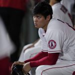 
              Los Angeles Angels starting pitcher Shohei Ohtani watches from the dugout during the third inning of the team's baseball game against the Houston Astros on Thursday, April 7, 2022, in Anaheim, Calif. (AP Photo/Ashley Landis)
            