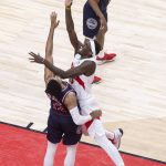
              Toronto Raptors forward Pascal Siakam (43) scores over Philadelphia 76ers forward Tobias Harris (12) during the first half of Game 3 of an NBA basketball first-round playoff series, Wednesday, April 20, 2022, in Toronto. (Chris Young/The Canadian Press via AP)
            
