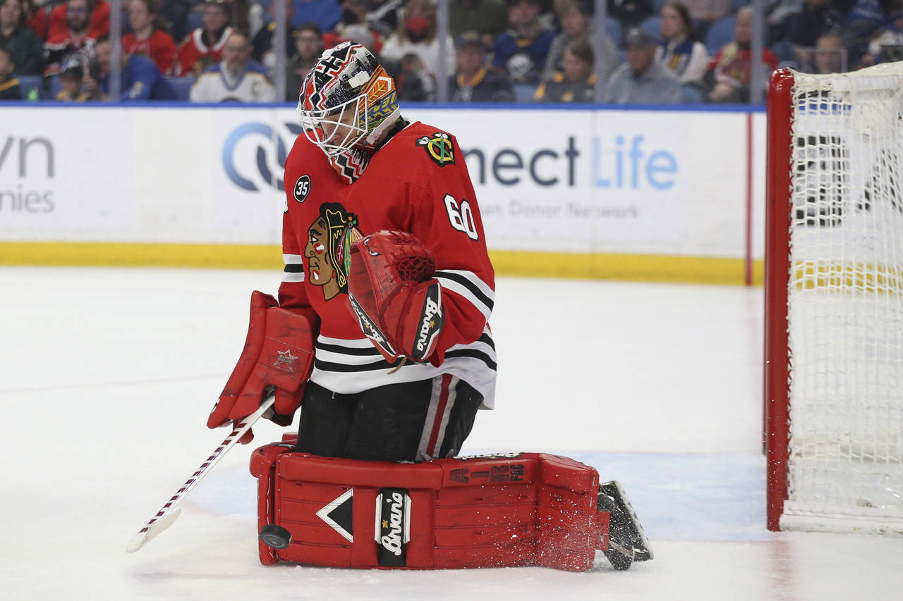 Chicago Blackhawks goaltender Collin Delia blocks a shot during the second period of the team's NHL...