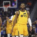 
              Utah Jazz guard Donovan Mitchell (45) smiles after scoring against the Golden State Warriors during the first half of an NBA basketball game in San Francisco, Saturday, April 2, 2022. (AP Photo/Jed Jacobsohn)
            
