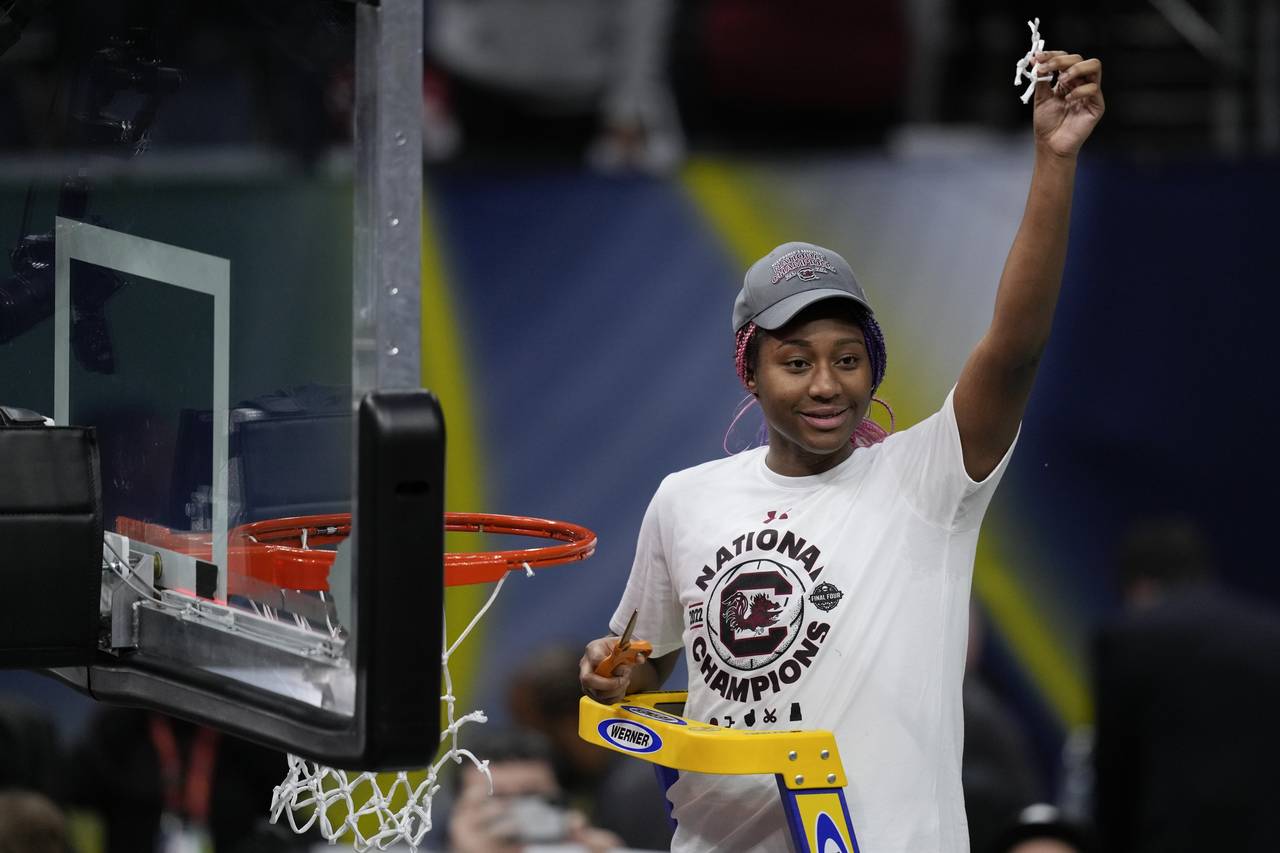 South Carolina's Aliyah Boston cuts the net after a college basketball game in the final round of t...