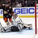 
              Anaheim Ducks center Adam Henrique, left, scores past Los Angeles Kings goaltender Jonathan Quick (32) during the second period of an NHL hockey game Tuesday, April 19, 2022, in Anaheim, Calif. (AP Photo/Marcio Jose Sanchez)
            