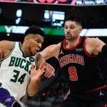 
              Milwaukee Bucks' Giannis Antetokounmpo tries to drive past Chicago Bulls' Nikola Vucevic during the first half of Game 1 of their first round NBA playoff basketball game Sunday, April 17, 2022, in Milwaukee . (AP Photo/Morry Gash)
            