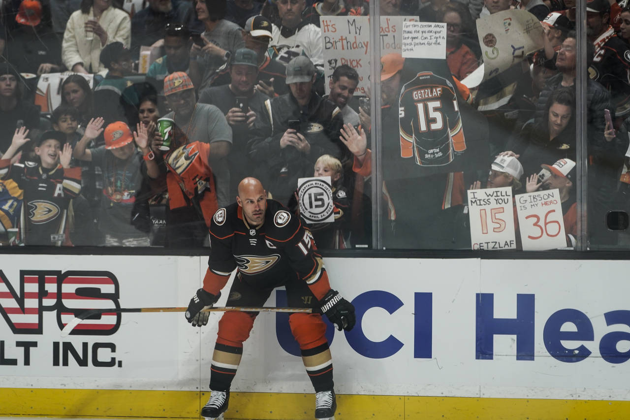 Fans cheer as Anaheim Ducks' Ryan Getzlaf pauses for a moment during warmups before the team's NHL ...