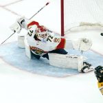 
              Florida Panthers goaltender Sergei Bobrovsky (72) stretches but can't get his glove on the puck on a goal by Boston Bruins left wing Erik Haula (56) during the first period of an NHL hockey game, Tuesday, April 26, 2022, in Boston. (AP Photo/Charles Krupa)
            