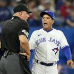 
              Toronto Blue Jays manager Charlie Montoyo (25) argues with umpire Jeff Nelson (45) after being ejected from the game during the eighth inning of a baseball game against the Oakland Athletics, Saturday, April 16, 2022 in Toronto. (Frank Gunn/The Canadian Press via AP)
            