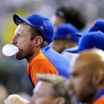 
              New York Mets starting pitcher Max Scherzer blows bubble from the dugout as he watches teammates play against the Arizona Diamondbacks during the third inning of a baseball game Sunday, April 24, 2022, in Phoenix. (AP Photo/Ross D. Franklin)
            