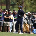 
              Tiger Woods watches his shot on the third hole during the second round at the Masters golf tournament on Friday, April 8, 2022, in Augusta, Ga. (AP Photo/Charlie Riedel)
            