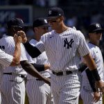 
              New York Yankees right fielder Aaron Judge (99) takes the field with his teammates before the Yankees opening day baseball game against the Boston Red Sox, Friday, April 8, 2022, in New York. (AP Photo/John Minchillo)
            