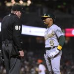 
              Oakland Athletics' Tony Kemp, right, reacts toward umpire Chris Conroy (98) after being called out on strikes during the seventh inning of the team's baseball game against the San Francisco Giants in San Francisco, Tuesday, April 26, 2022. (AP Photo/Jeff Chiu)
            