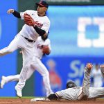 
              San Francisco Giants' Steven Duggar steals second base as Cleveland Guardians shortstop Andres Gimenez waits for the throw in the third inning of a baseball game, Saturday, April 16, 2022, in Cleveland. (AP Photo/David Dermer)
            