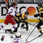 
              New York Rangers' Dryden Hunt (29) and Boston Bruins' Charlie McAvoy (73) fight during the second period of an NHL hockey game, Saturday, April 23, 2022, in Boston. (AP Photo/Michael Dwyer)
            