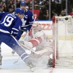 
              Toronto Maple Leafs center Jason Spezza (19) and Detroit Red Wings goaltender Alex Nedeljkovic (39) watch as the puck misses the net during the second period of an NHL hockey game in Toronto, Tuesday, April 26, 2022. (Frank Gunn/The Canadian Press via AP)
            