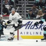 
              Los Angeles Kings center Gabriel Vilardi (13) and Seattle Kraken right wing Daniel Sprong (91) eye the puck as Kraken goaltender Philipp Grubauer, left, watches from the goal during the second period of an NHL hockey game, Wednesday, April 27, 2022, in Seattle. (AP Photo/Ted S. Warren)
            