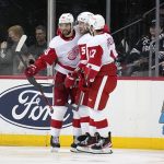 
              Detroit Red Wings' Joe Veleno, left, celebrates his goal with teammates during the third period of an NHL hockey game against the New Jersey Devils in Newark, N.J., Friday, April 29, 2022. The Red Wings defeated the Devils 5-3. (AP Photo/Seth Wenig)
            