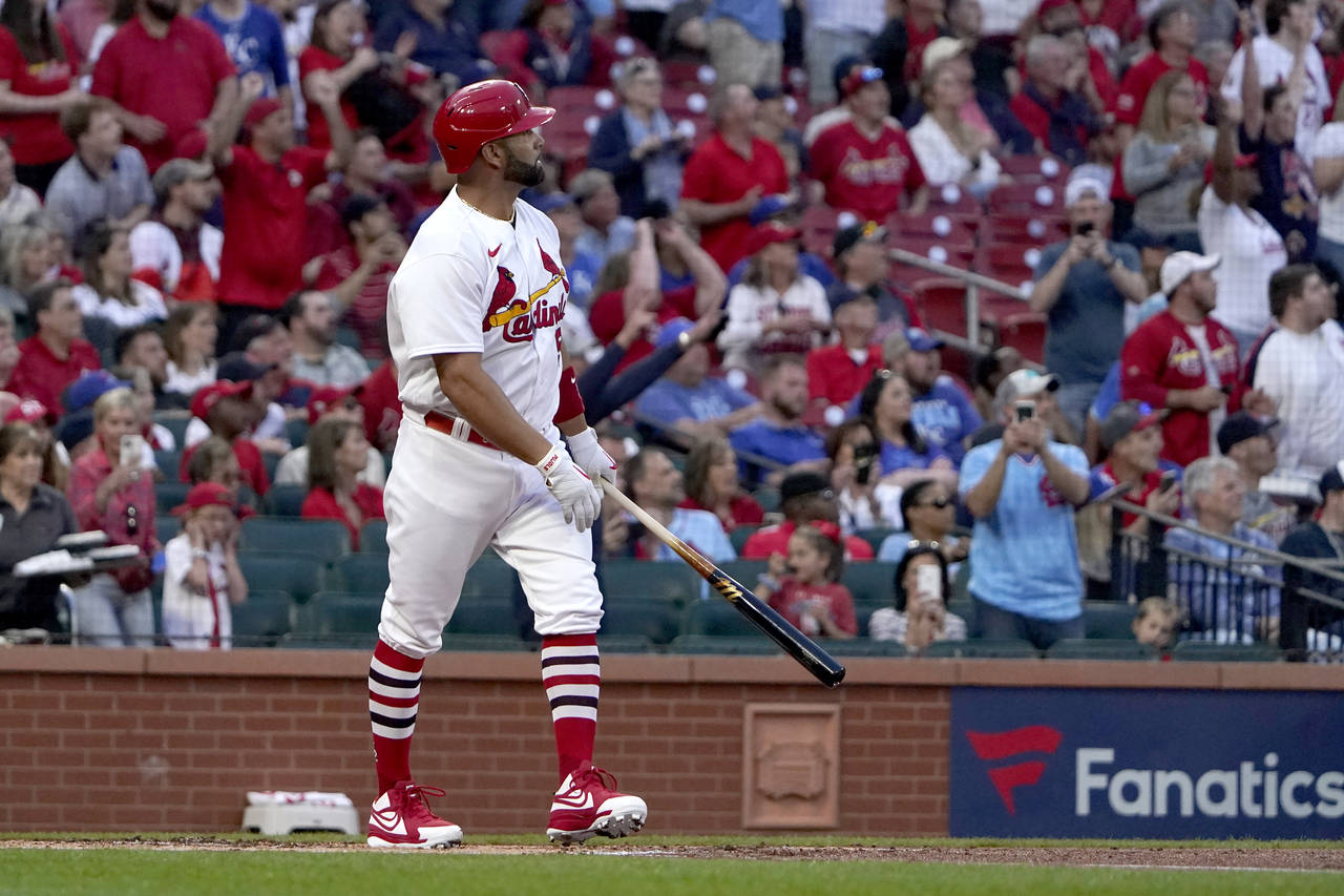 St. Louis Cardinals' Albert Pujols watches his solo home run during the first inning of a baseball ...