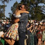 
              Scottie Scheffler lifts his wife Meredith Scudder off her feet after winning the 86th Masters golf tournament on Sunday, April 10, 2022, in Augusta, Ga. (AP Photo/David J. Phillip)
            