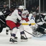 
              Los Angeles Kings goaltender Jonathan Quick (32) deflects a shot by Columbus Blue Jackets right wing Jakub Voracek (93) during the first period of an NHL hockey game Saturday, April 16, 2022, in Los Angeles. (AP Photo/Ashley Landis)
            