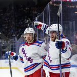 
              New York Rangers' Andrew Copp, right, celebrates with Artemi Panarin after scoring a goal during the first period of the team's NHL hockey game against the New York Islanders on Thursday, April 21, 2022, in Elmont, N.Y. (AP Photo/Frank Franklin II)
            