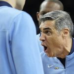 
              Villanova head coach Jay Wright yells to his players during the first half of a college basketball game against Kansas in the semifinal round of the Men's Final Four NCAA tournament, Saturday, April 2, 2022, in New Orleans. (AP Photo/Brynn Anderson)
            