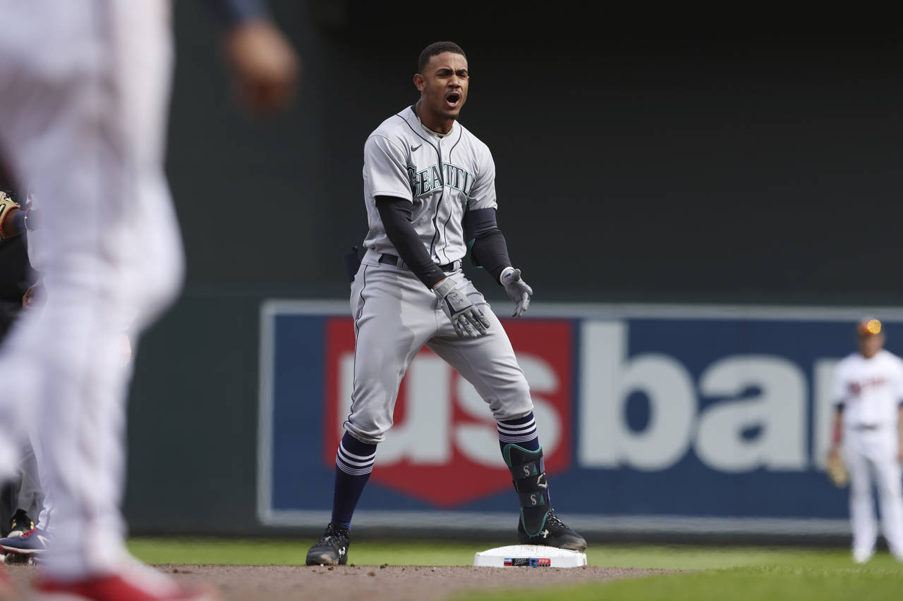 Seattle Mariners center fielder Julio Rodriguez (44) reacts after doubling on a line drive to Minne...