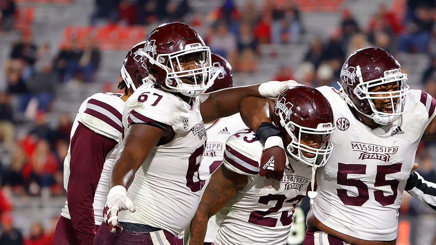 Charles Cross (No. 67) reacts after a Mississippi State touchdown on Nov. 21, 2020. (Photo by Kevin...