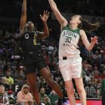 LAS VEGAS, NEVADA - MAY 08: Breanna Stewart #30 of the Seattle Storm blocks a shot by Jackie Young #0 of the Las Vegas Aces during their game at Michelob ULTRA Arena on May 08, 2022 in Las Vegas, Nevada. NOTE TO USER: User expressly acknowledges and agrees that, by downloading and or using this photograph, User is consenting to the terms and conditions of the Getty Images License Agreement. (Photo by Ethan Miller/Getty Images)