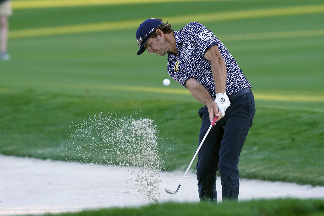 FILE - Lanto Griffin hits from a bunker on the 17th fairway during the first round of play in the P...