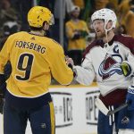 
              Colorado Avalanche left wing Gabriel Landeskog (92) shakes hands with Nashville Predators' Filip Forsberg (9) after Game 4 of an NHL hockey first-round playoff series Monday, May 9, 2022, in Nashville, Tenn. The Avalanche won 5-3 to sweep the series 4-0. (AP Photo/Mark Humphrey)
            