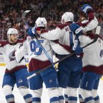 
              Colorado Avalanche celebrate a goal against the Edmonton Oilers during first-period NHL hockey game action in Edmonton, Alberta, Friday, April 22, 2022. (Jason Franson/The Canadian Press via AP)
            