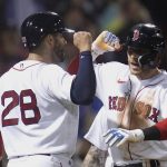 Boston Red Sox's Trevor Story, right, celebrates with J.D. Martinez after his three-run home run against the Seattle Mariners in the eighth inning of a baseball game at Fenway Park, Thursday, May 19, 2022, in Boston. Story hit two two-run home runs earlier in the game. (AP Photo/Charles Krupa)