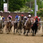 
              Horses round the fourth turn during the 148th running of the Kentucky Derby horse race at Churchill Downs Saturday, May 7, 2022, in Louisville, Ky. (AP Photo/Brynn Anderson)
            