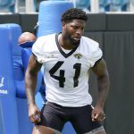 
              Jacksonville Jaguars Josh Allen (41) performs a drill at an NFL football practice, Monday, May 23, 2022, in Jacksonville, Fla. (AP Photo/John Raoux)
            
