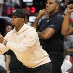 
              Miami Heat guard Kyle Lowry (7) gestures to his teammates from the sidelines during the first half of Game 1 of an NBA basketball Eastern Conference finals playoff series against the Boston Celtics, Tuesday, May 17, 2022, in Miami. (AP Photo/Lynne Sladky)
            