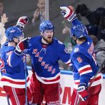 
              New York Rangers' Alexis Lafreniere (13) celebrates with teammates Filip Chytil (72) and Jacob Trouba (8) after scoring a goal during the second period of Game 5 of an NHL hockey Stanley Cup first-round playoff series against the Pittsburgh Penguins Wednesday, May 11, 2022, in New York. (AP Photo/Frank Franklin II)
            