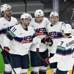 
              Team of USA celebrate a goal during the 2022 IIHF Ice Hockey World Championships preliminary round group B match between Austria and USA in Tampere, Finland, Sunday May 15, 2022. (Vesa Moilanen/Lehtikuva via AP)
            