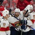 
              Florida Panthers defenseman Gustav Forsling, right wing Claude Giroux, center Carter Verhaeghe and center Aleksander Barkov, from left, celebrate Giroux's goal against the Washington Capitals during the third period of Game 6 of a first-round NHL hockey Stanley Cup playoff series Friday, May 13, 2022, in Washington. (AP Photo/Alex Brandon)
            