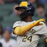 
              Milwaukee Brewers' Andrew McCutchen hits a single in the first inning of a baseball game against the Atlanta Braves, Friday, May 6, 2022, in Atlanta. (AP Photo/John Bazemore)
            