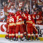 
              Calgary Flames celebrate defeating the Dallas Stars in overtime NHL playoff hockey action in Calgary, Alberta, Sunday, May 15, 2022. (Jeff McIntosh/The Canadian Press via AP)
            