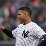 
              New York Yankees' Gleyber Torres gestures after being interviewed after the first game of a baseball double-header against the Texas Rangers at Yankee Stadium, Sunday, May 8, 2022, in New York. (AP Photo/Seth Wenig)
            